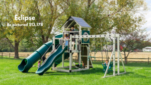 The Eclipse has three different slides, including a tube & a spiral slide! Climb up via the rock wall or ladder. Turn the bottom of the tower into a sandbox. Play on the monkey bars or swing on the glider or trapeze bar. This set has a bubble panel, tic-tac-toe & a ship’s wheel. Choose white swing set with gray decking or ivory swing set with brown decking. Recommended ages 2-12 years old. Price as pictured $13,178.00 - not including delivery and installation.